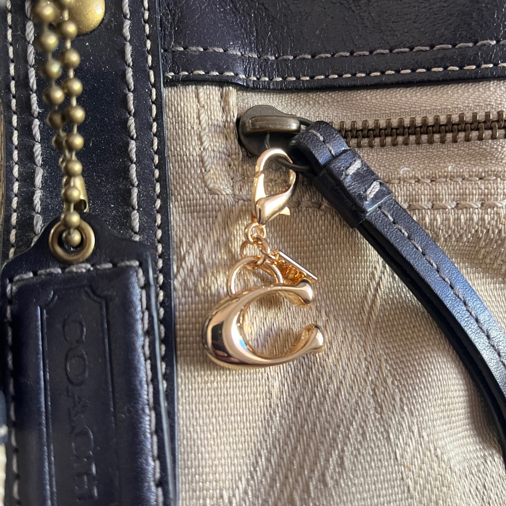 Gold Toned Signature C Zipper Pull Charm.
